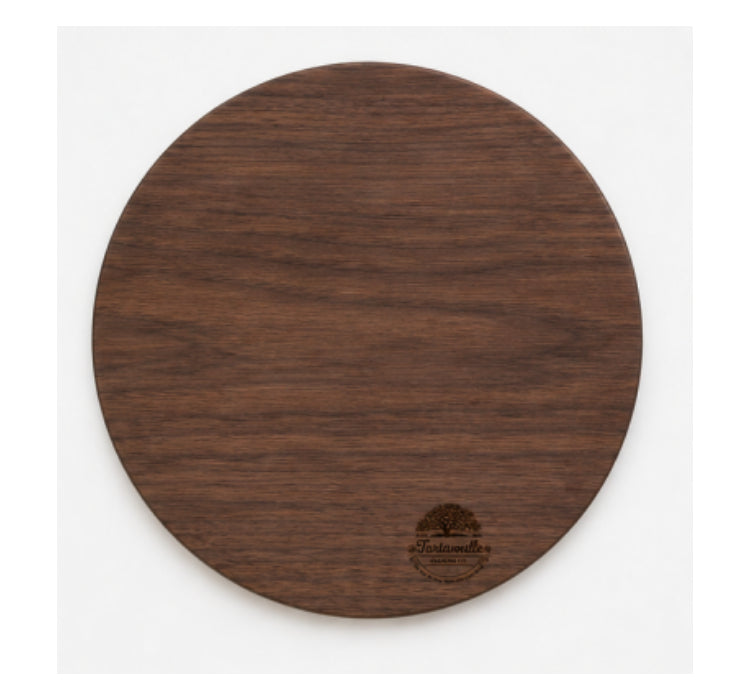 The Cowbell 18-inch round grazing board in Black Walnut